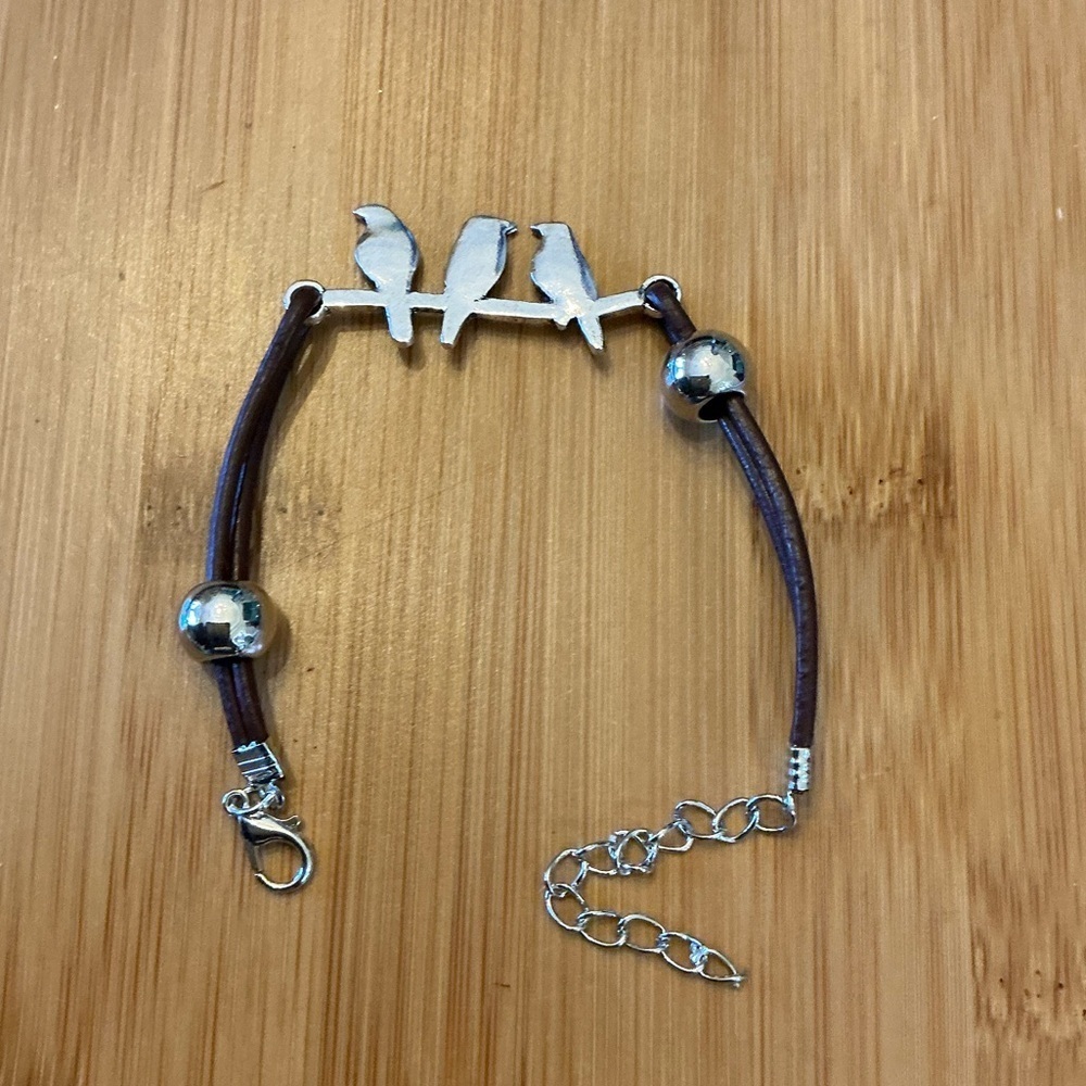 Bird bracelet with cord and chain, 10”.